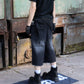 Binary distressed denim shorts